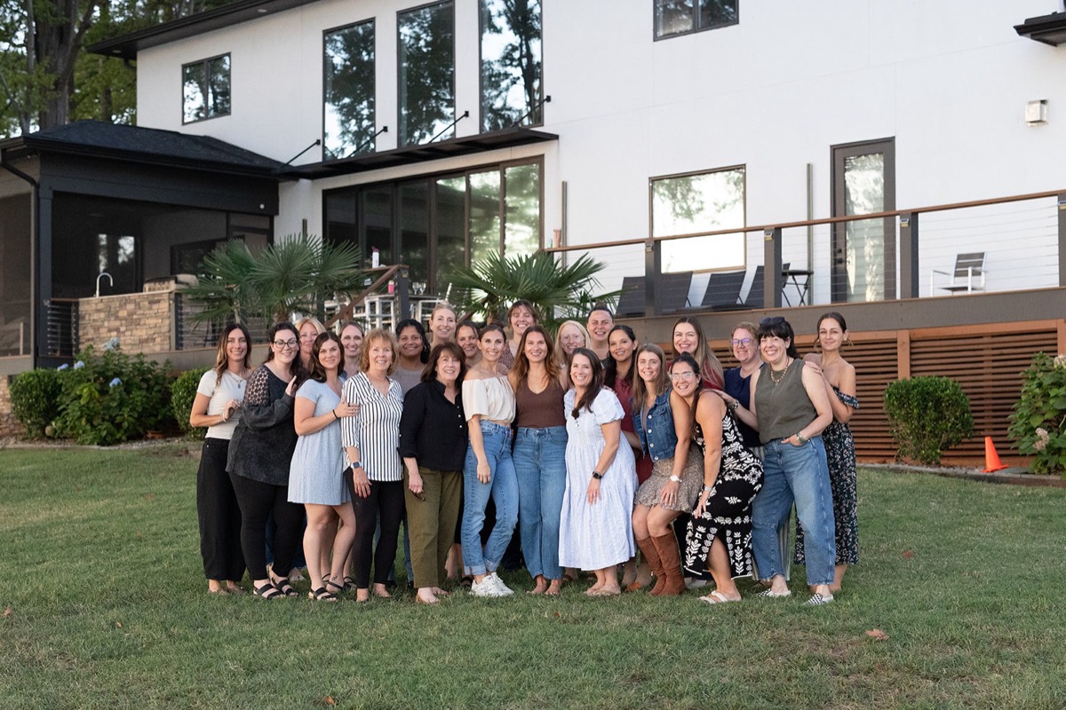 The whole Reset Retreat group together on the lawn of the lake house
